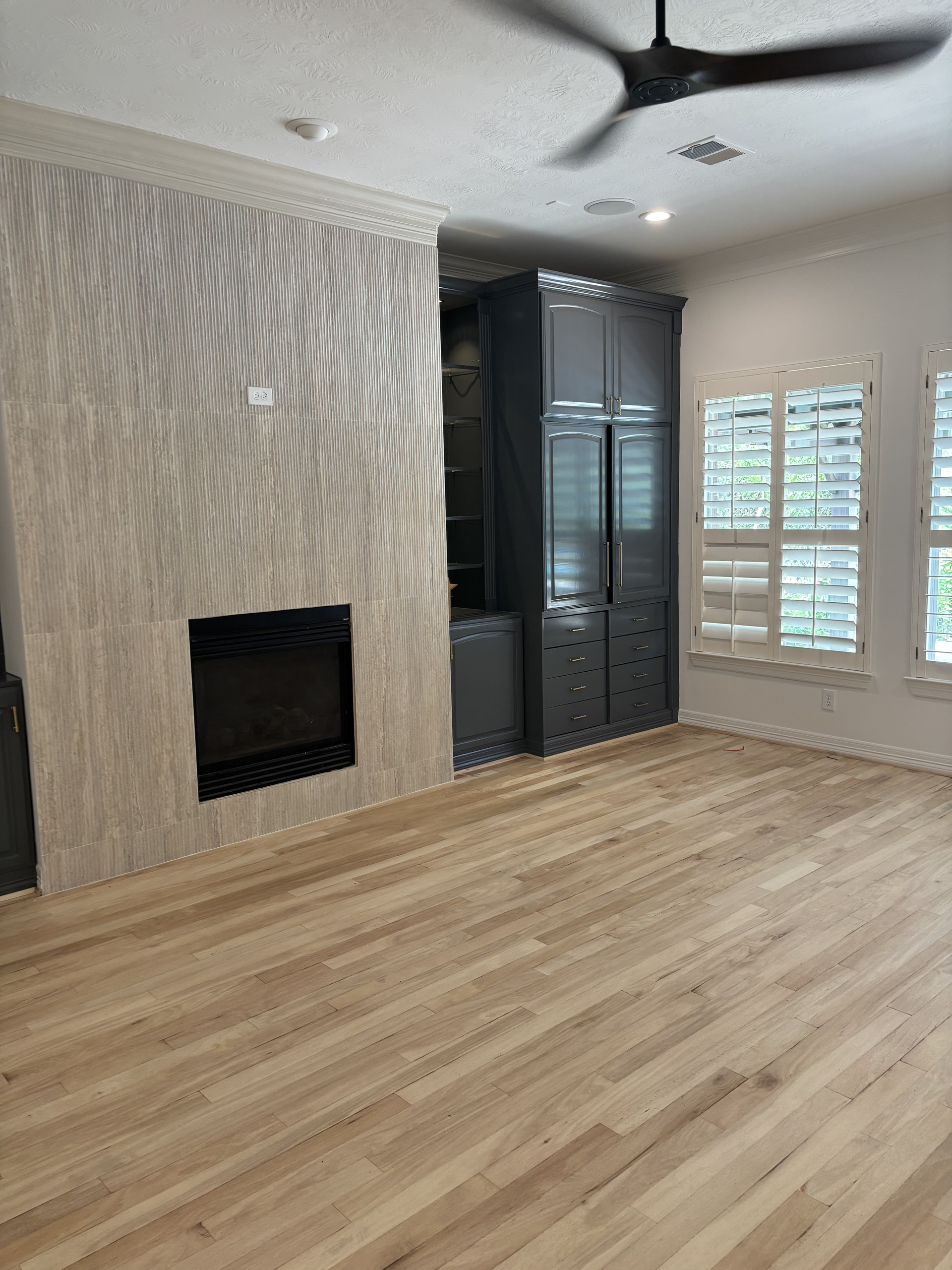 The cabinets and floors were already here. We repainted and refinished them.
